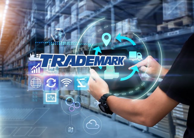 Man hands using tablet on blurred warehouse as background